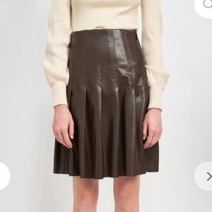 Knee length pleated leather skirt